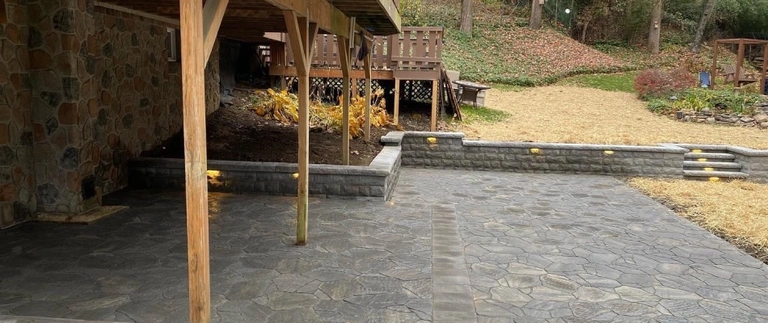 Outdoor lighting feature added to retaining walls by patio in Easton, PA.