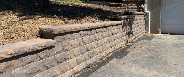 Tall retaining wall built beside driveway in Bethlehem, PA.