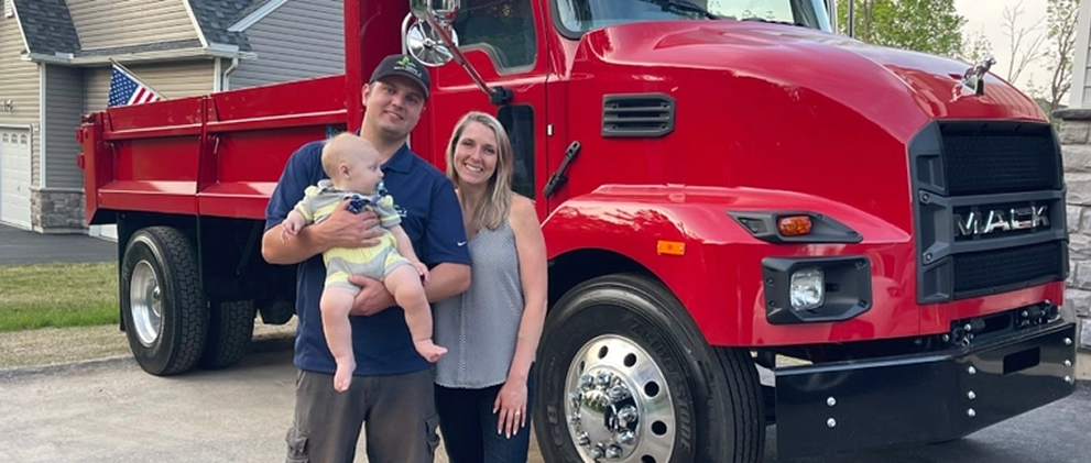 Trevor and his family posed in front of a red work truck in Easton, PA.